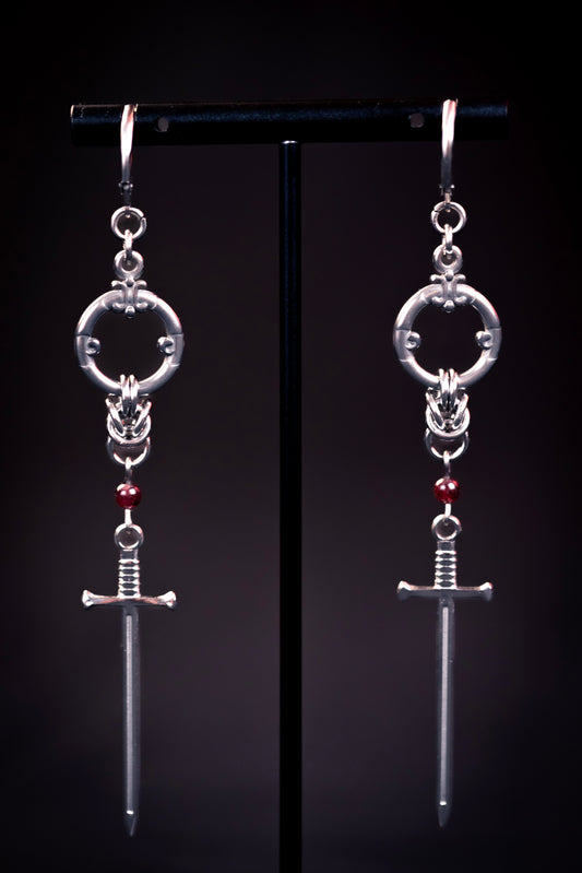ARYA | Chainmail Earrings
Stainless steel chainmail earrings with a garnet stone and a silver sword