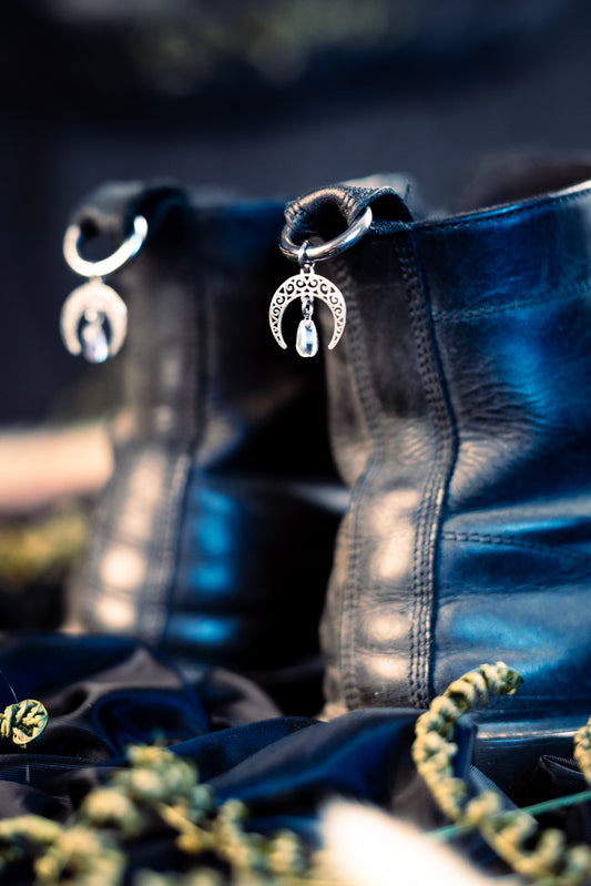moon shoe charms featuring an iridescent glass bead and a stainless steel  hoop clasp 