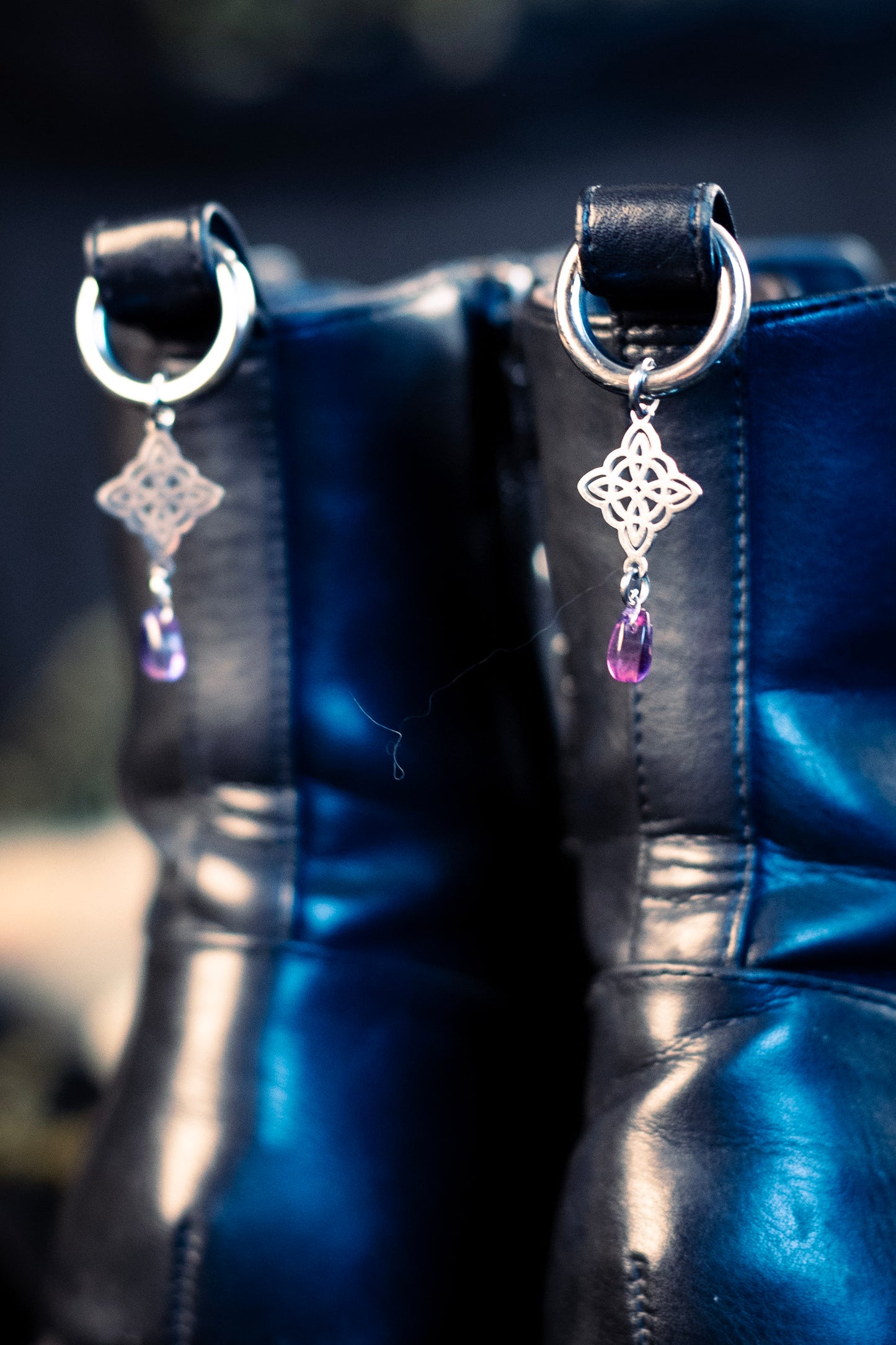 witch's knot shoe charms featuring a purple glass bead and a stainless steel  hoop clasp 