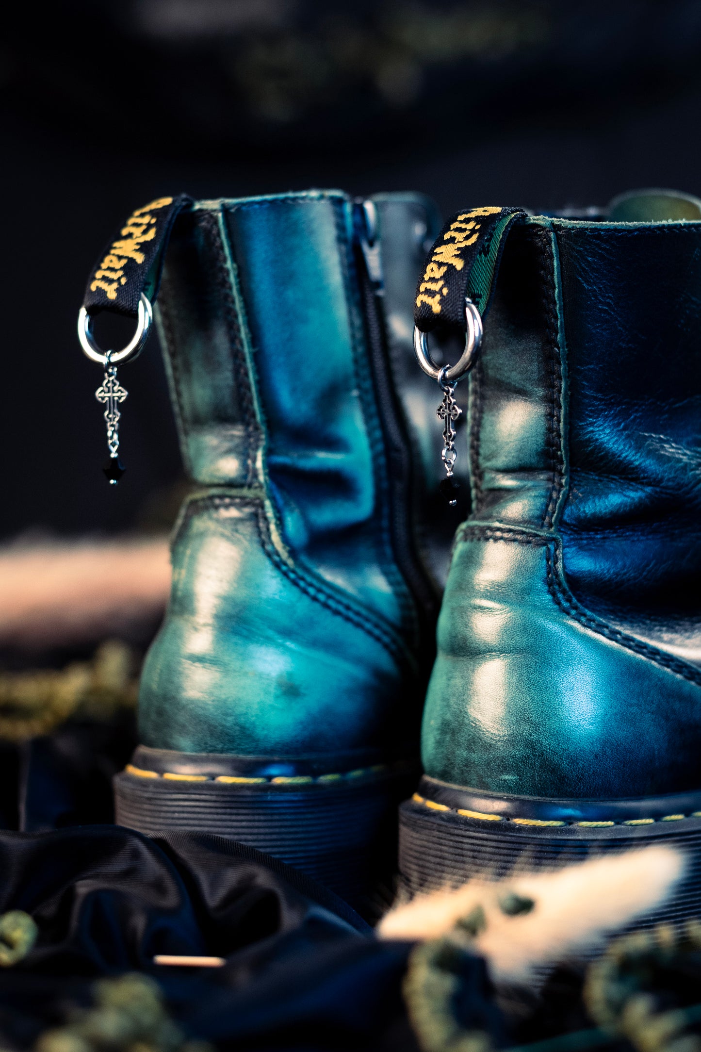 cross shoe charms with a stainless steel  hoop clasp 