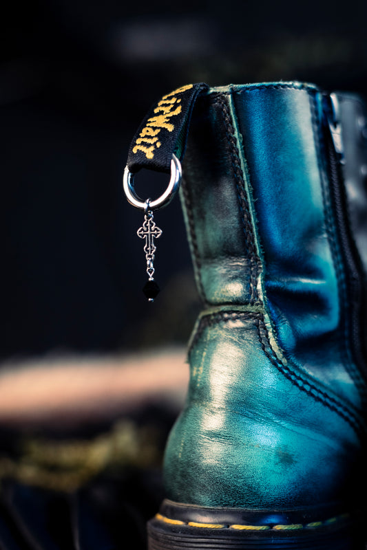 cross shoe charms with a stainless steel  hoop clasp 